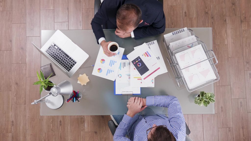 top-view-of-businessman-in-suit-drinking-coffee